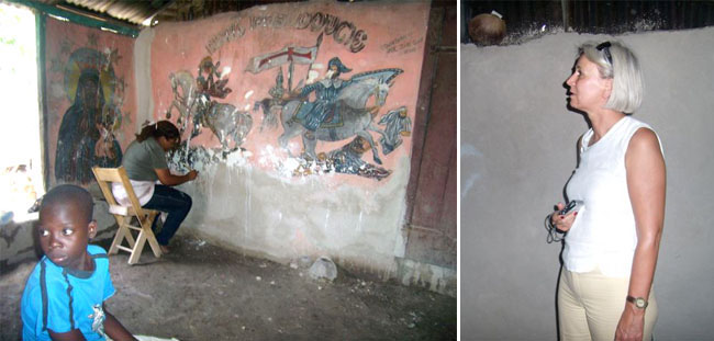Chez Andersonn Belony, Madame VERDEGAAL suit avec attention les gestes de Tessa Mars en train de restaurer les peintures murales Chez Andersonn Belony, Madame VERDEGAAL suit avec attention les gestes de Tessa Mars en train de restaurer les peintures murales